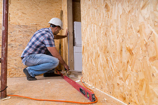istock Builder Measuring Door Frame In Unfinished Home 521800980