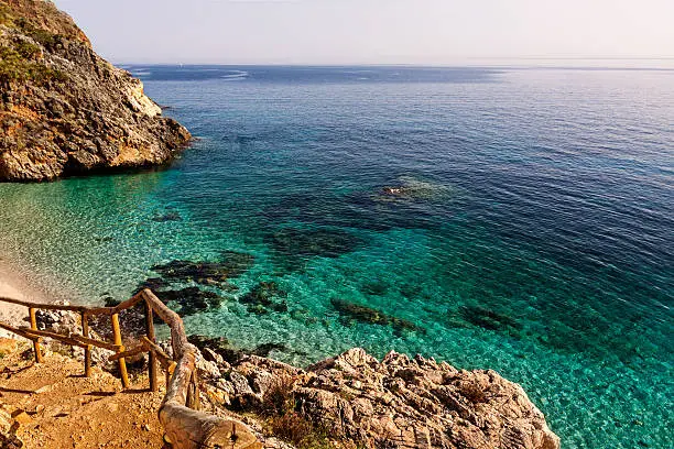 Photo of Blue Transparent Sea and Mountains