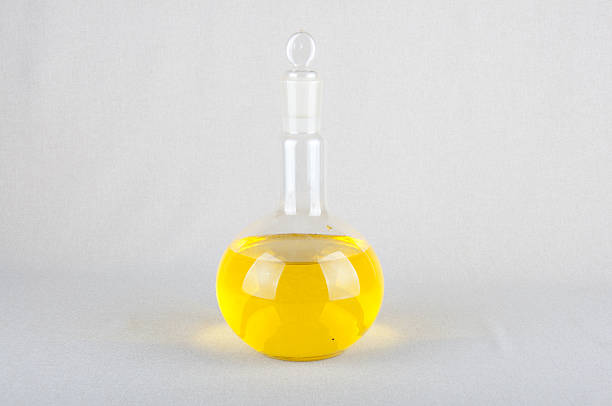 istock Yellow liquid in laboratory glassware 521802222