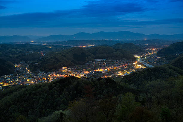 istock Japanese city, surrounded by mountains 521802288
