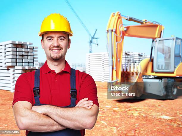 Handyman At Construction Site Stock Photo - Download Image Now - Adult, Backhoe, Blue-collar Worker