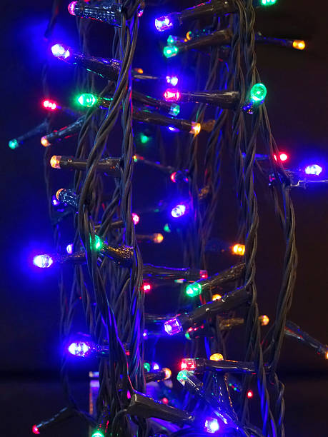 istock Tangled multi-coloured Christmas tree fairy lights, twinkling xmas lights image 521804281