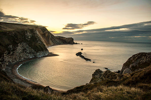 istock Durdle Door at sunrise 521804334