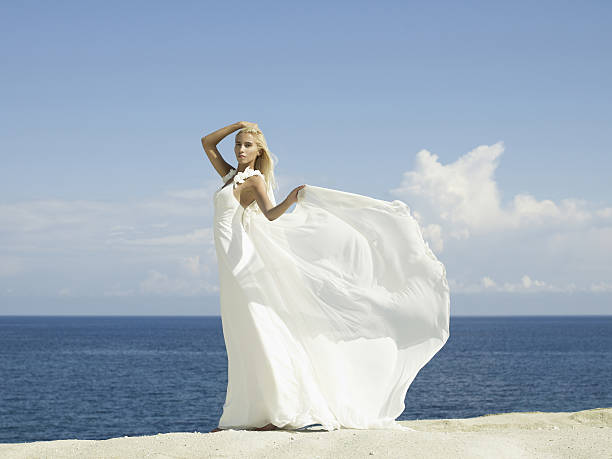 istock Beautiful elegant bride at the seashore 521804371