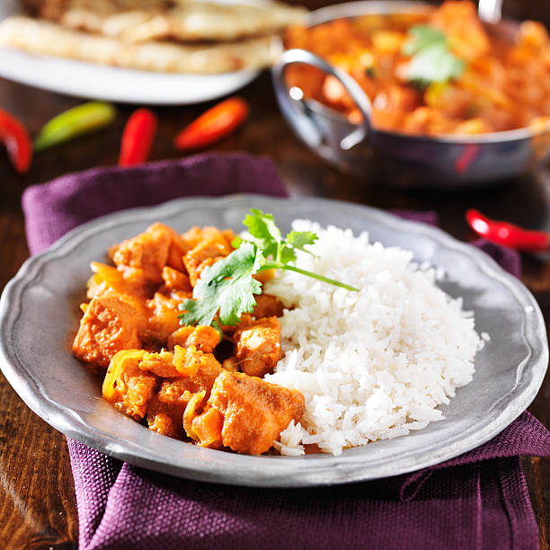 istock indian chicken vindaloo curry with basmati rice 521804625
