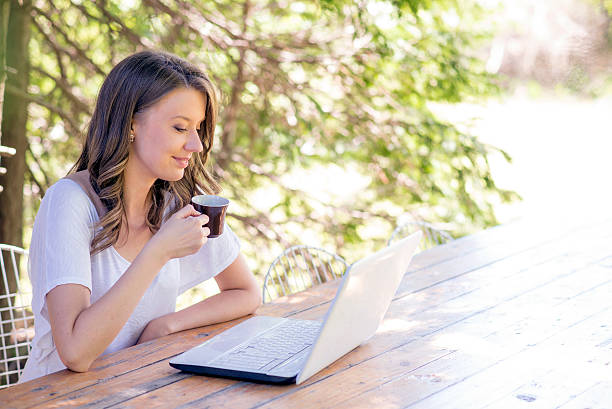 istock Young businesswoman with laptop 521805314