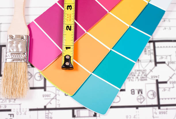 istock Painting, DIY tools lie on home blueprints, plans. 521805744