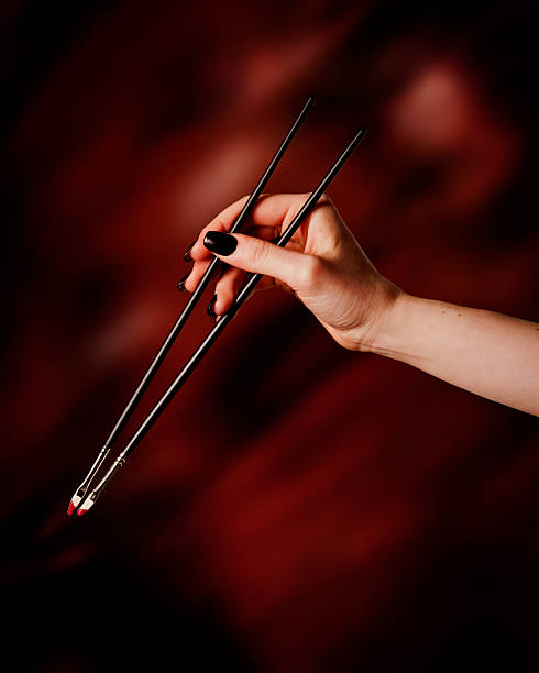 istock Female hand holding paint brushes 521805875