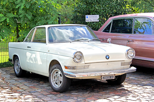 Berlin, Germany - August 12, 2014: German retro car BMW 700 Coupe is parked in the city street near the museum of vintage cars Classic Remise.