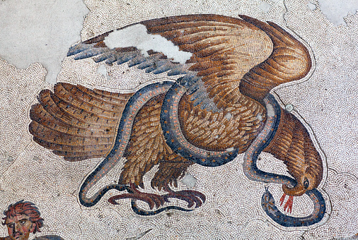 Istanbul, Turkey - November 2, 2015: Ancient mosaic from the Byzantine period in the Great Palace Mosaic Museum in Istanbul, Turkey. the Great Palace of Constantinople was constructed during the reign of Justinian I (527-565). The Great Palace mosaic was the largest and the most beautiful landscape in antiquity (6th century A.D).