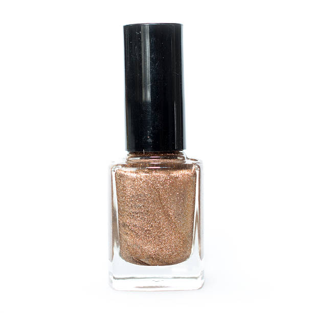 istock Single Bottle of gold nail polish 521808684