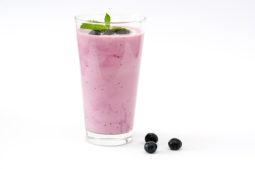 Fresh blueberry smoothie on white background