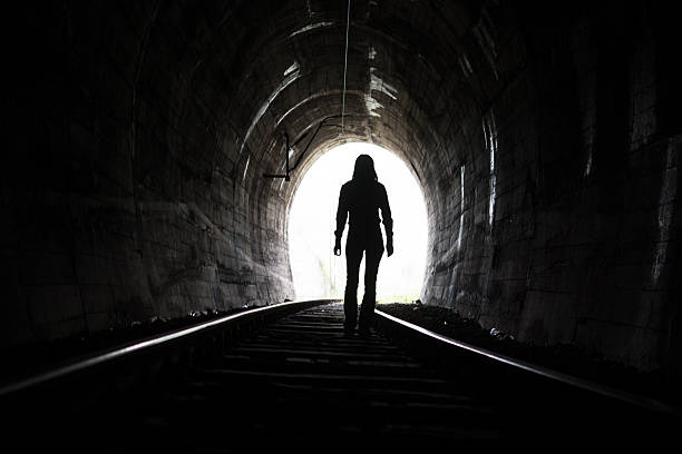 istock Person At End of Tunnel 521810542