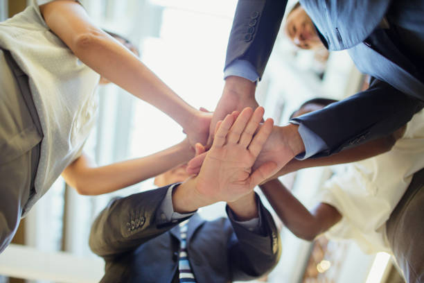 istock Business people putting hands together 521811121