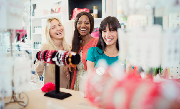 istock Women shopping together in store 521811149
