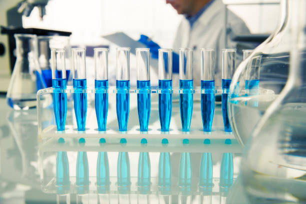 istock Rack of test tubes with solution on counter in lab 521811155