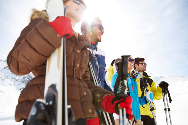 istock Friends standing with skis on mountain top 521811219