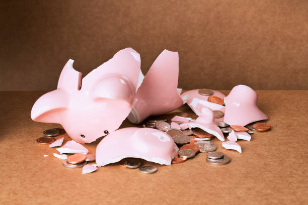 istock Broken piggy bank on counter 521811563