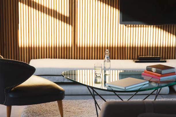 istock Window casting shadows in modern living room 521811581
