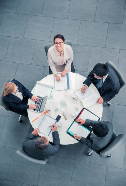 Business people talking in meeting at table