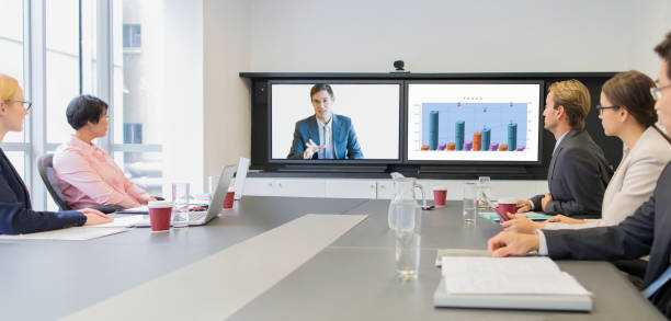 istock Business people using teleconference in meeting 521811785