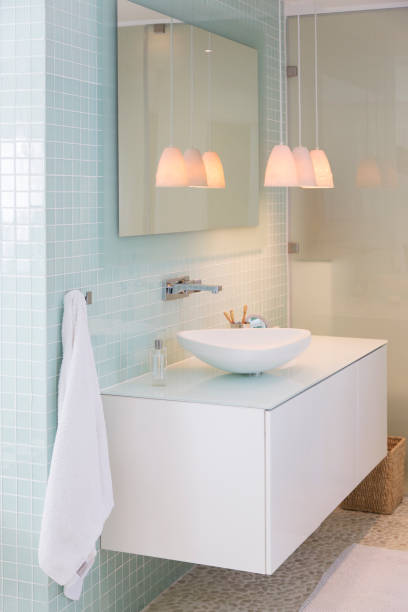 istock Sink, mirror and lamps in modern bathroom 521811821