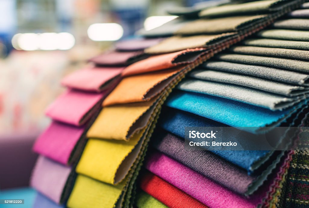 Colorful upholstery fabric samples Colorful upholstery fabric samples in a furniture store. Textile Stock Photo