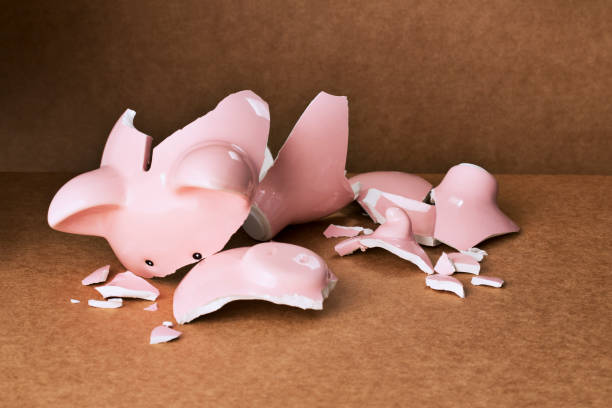 istock Broken piggy bank on counter 521812267