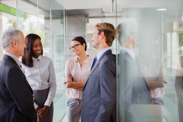 istock Business people talking in office building 521812305