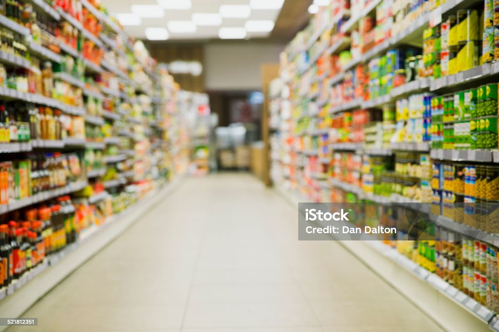 Defocussed view of grocery store aisle  Canned Food Stock Photo