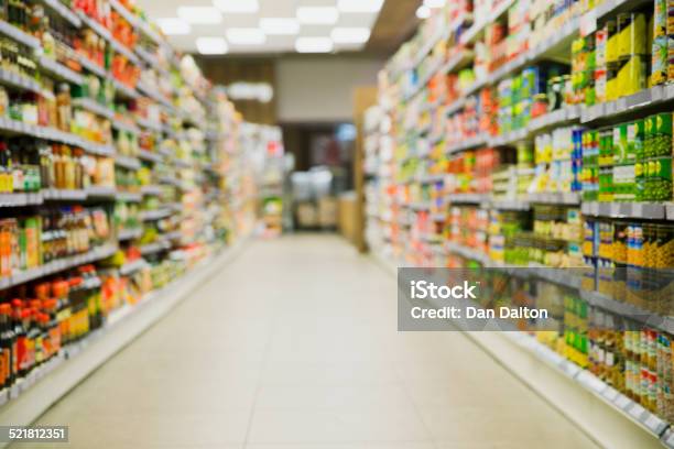 Defocussed View Of Grocery Store Aisle Stock Photo - Download Image Now - Canned Food, Can, Supermarket