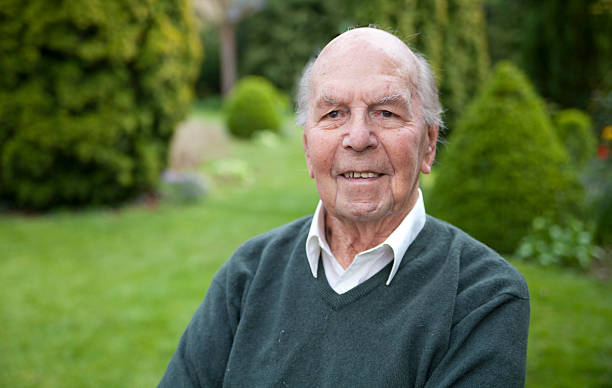 Portrait of 95 years old english man in his garden stock photo