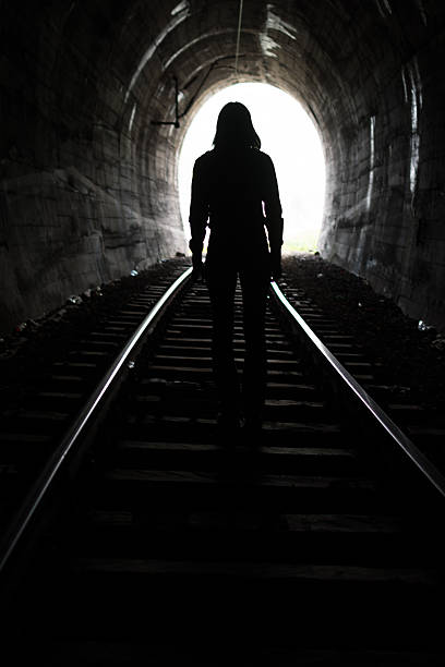 istock Person At End of Tunnel 521813172