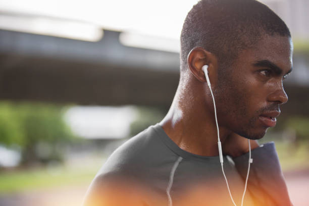 istock Man resting after exercising on city street 521813253