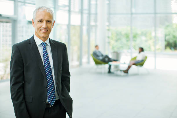 istock Businessman smiling in office building 521813513