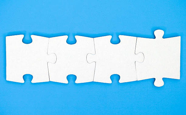 istock Four pieces of puzzle are connected together 521813580