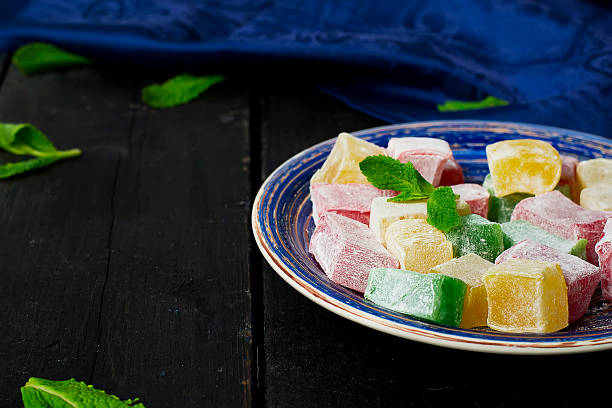 istock lokum - traditional Turkish sweets on a dark background 521814576