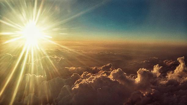 istock Aerial View of Sun Burst Sunset Beams Above Cloudscape 521815198