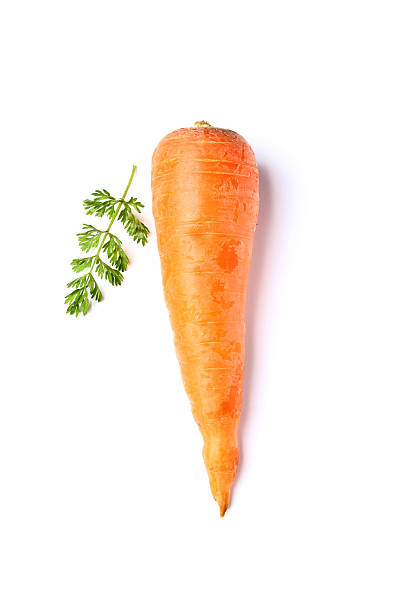 istock Carrot with leaves isolated. 521816324