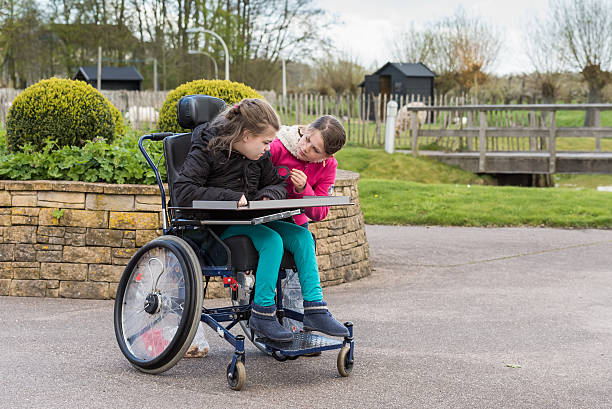 istock Disability a disabled person   together with her sister 521817614