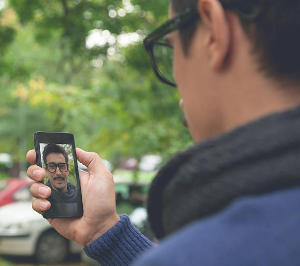 istock Attractive Male With Moustaches Taking Selfie 521818703