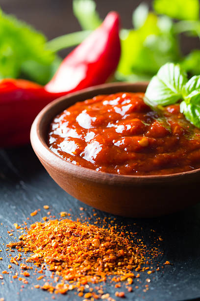 istock Fresh, dry ground and salsa chili on stone board 521818738