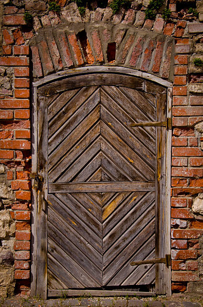 Old fortress door in the brick wall