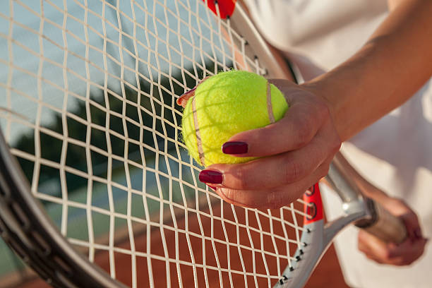istock Player's Hand With Tennis Racket And Ball 521819401