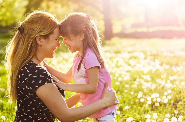 istock Mother and child together in nature in springtime 521820094