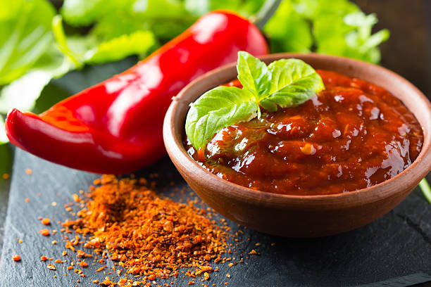 istock Fresh, dry ground and salsa chili on stone board 521820230
