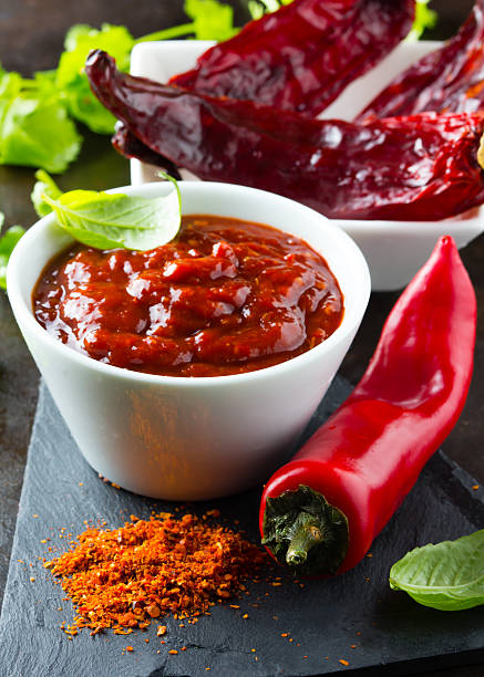 istock Fresh, dry ground and salsa chili on stone board 521820344