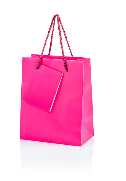istock pink papaer bag isolated 521821493