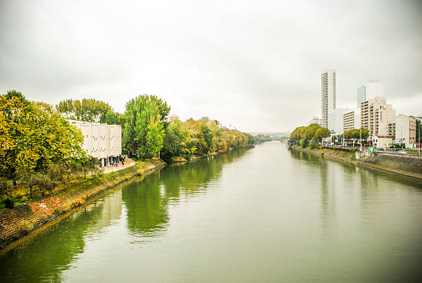 istock Paris river Seine view with trees and boats docking 521821539
