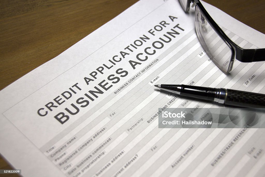 Business account credit Someone filling out Credit application for a business account Advice Stock Photo